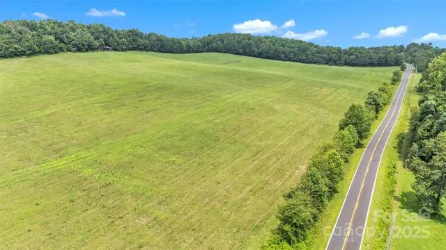 a view of a field with an ocean