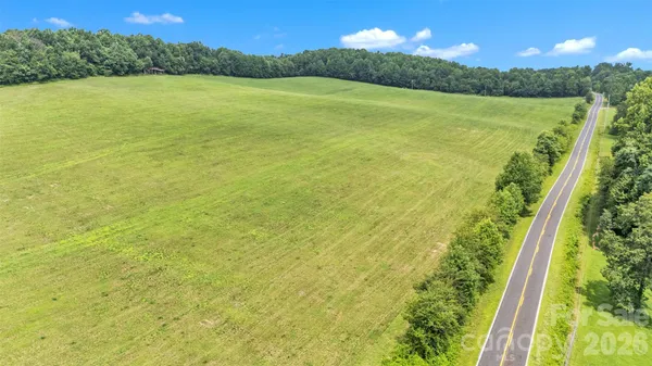 a view of a field with an ocean