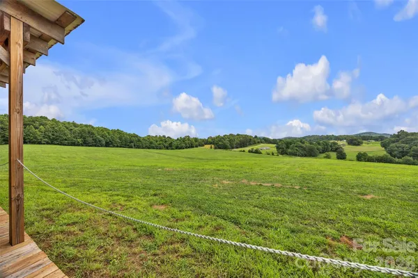 a view of a field with an ocean