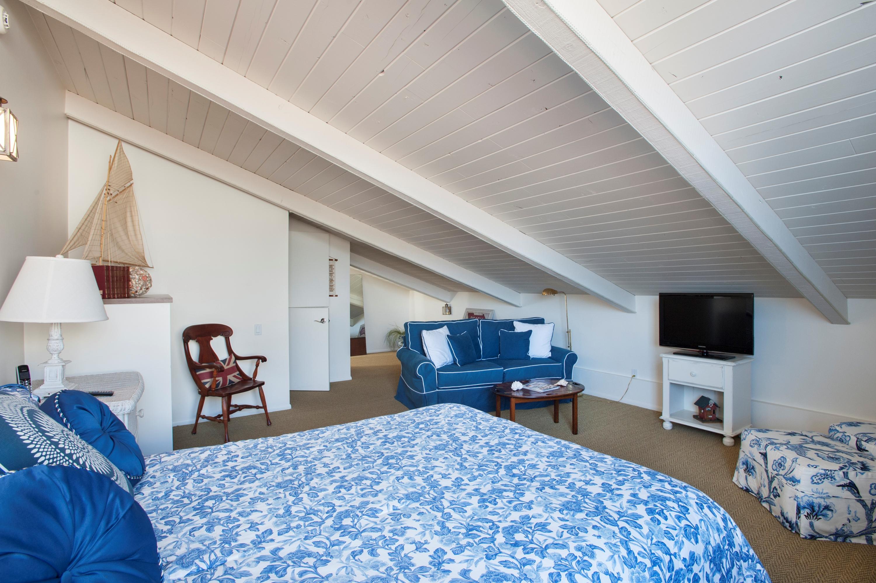 3284 Beach Club Road Carpinteria, CA 93013 - Photo 13 of 17 a bedroom with a bed and a flat tv screen on the dresser