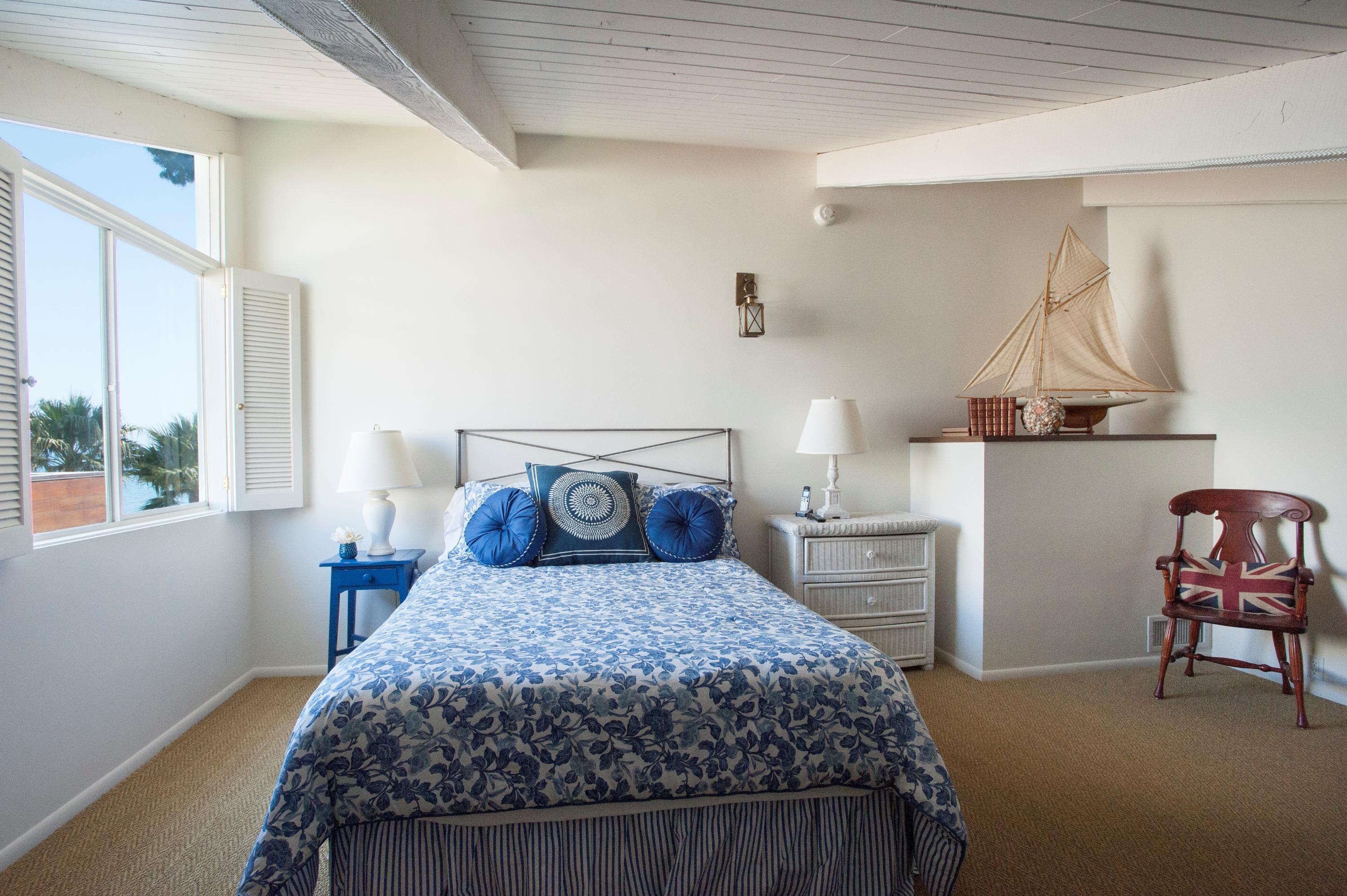 3284 Beach Club Road Carpinteria, CA 93013 - Photo 14 of 17 a bedroom with a bed and chair