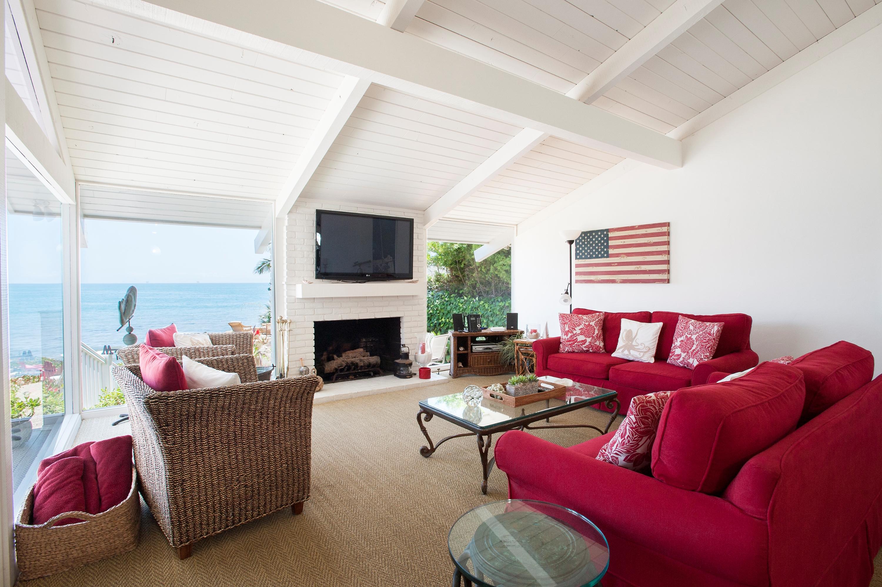 3284 Beach Club Road Carpinteria, CA 93013 - Photo 7 of 17 a living room with furniture a flat screen tv and a fireplace
