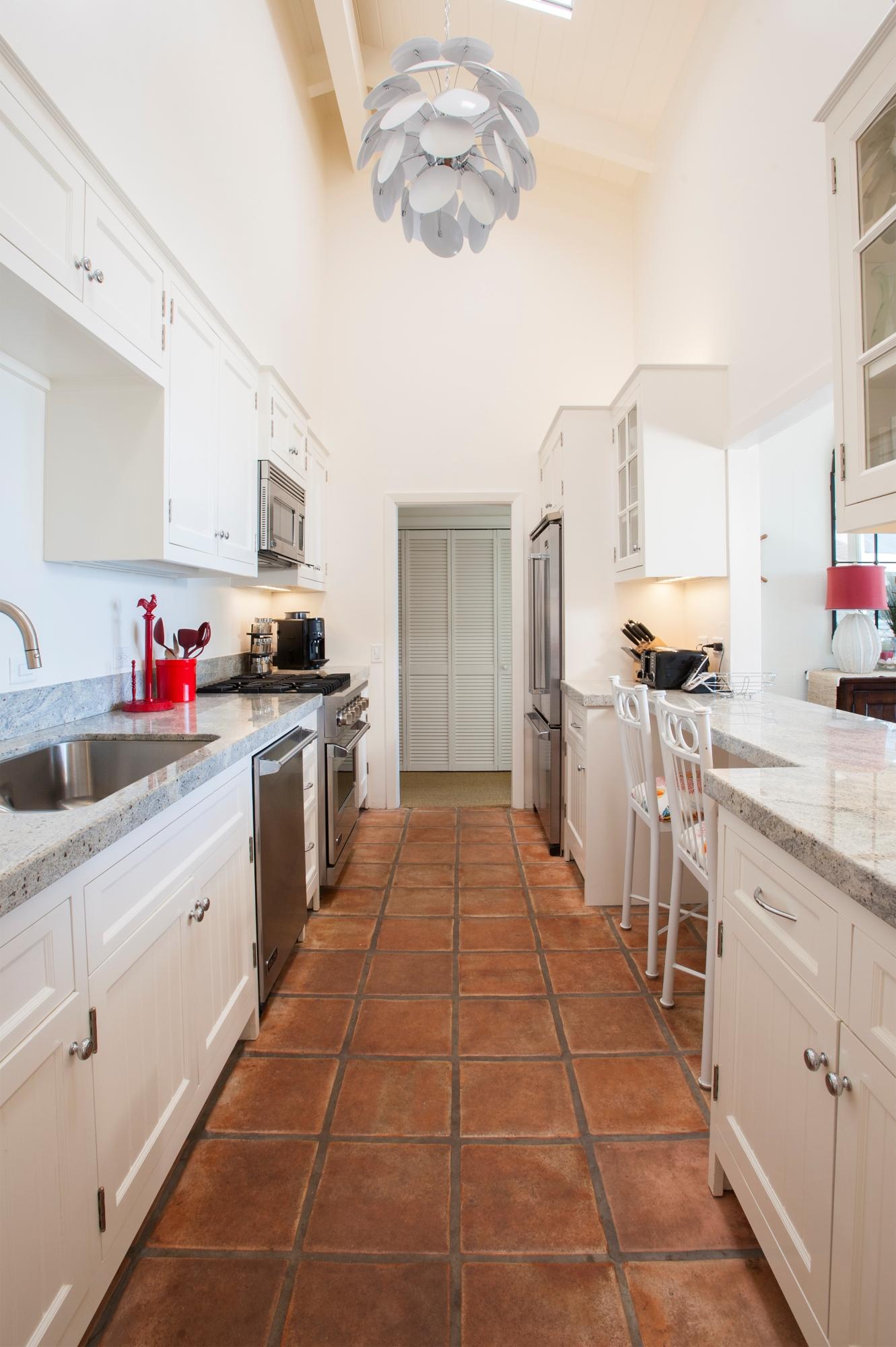 3284 Beach Club Road Carpinteria, CA 93013 - Photo 8 of 17 a kitchen with stainless steel appliances a sink stove and cabinets