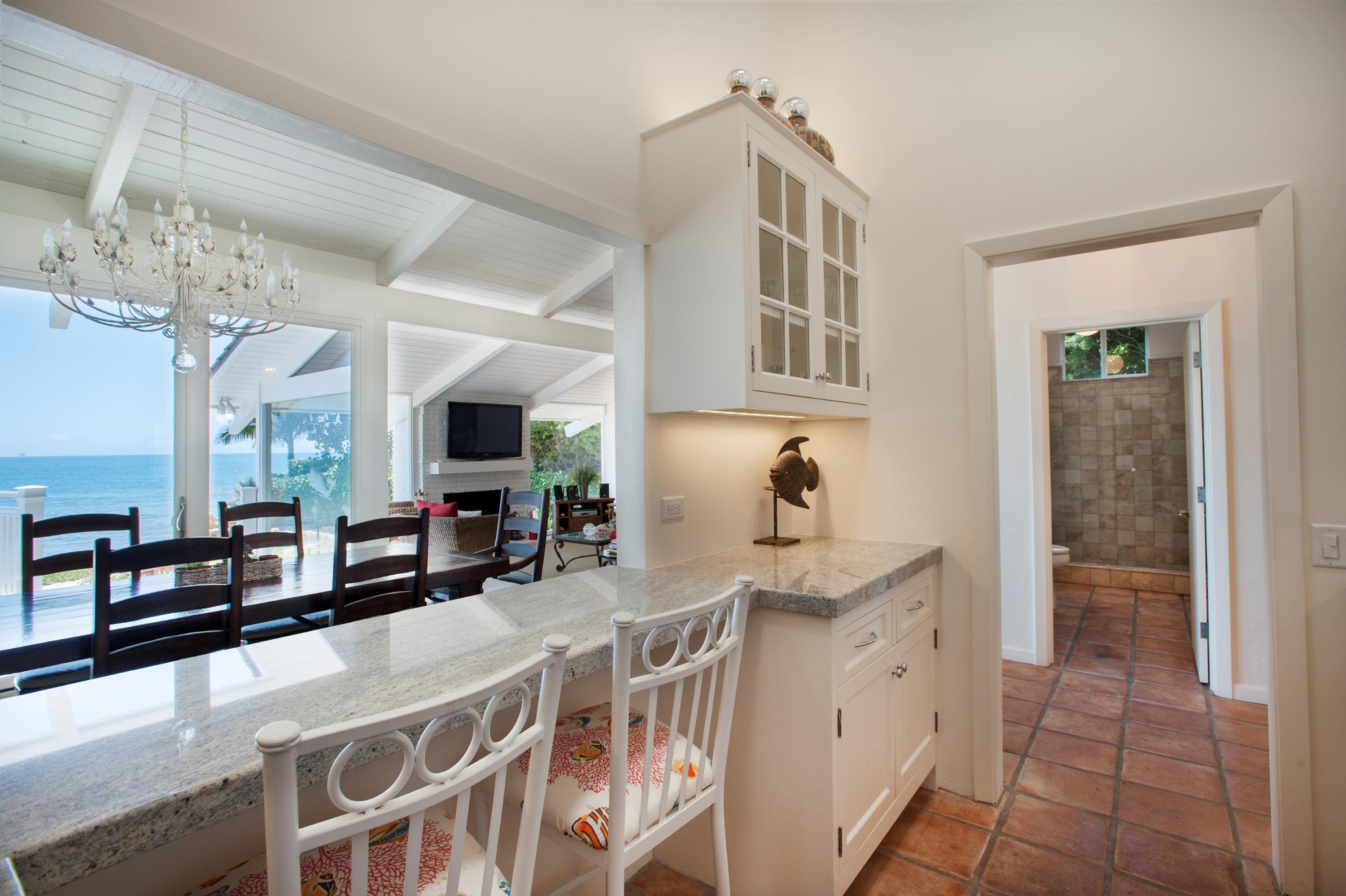 3284 Beach Club Road Carpinteria, CA 93013 - Photo 9 of 17 a kitchen with stainless steel appliances granite countertop a sink and cabinets
