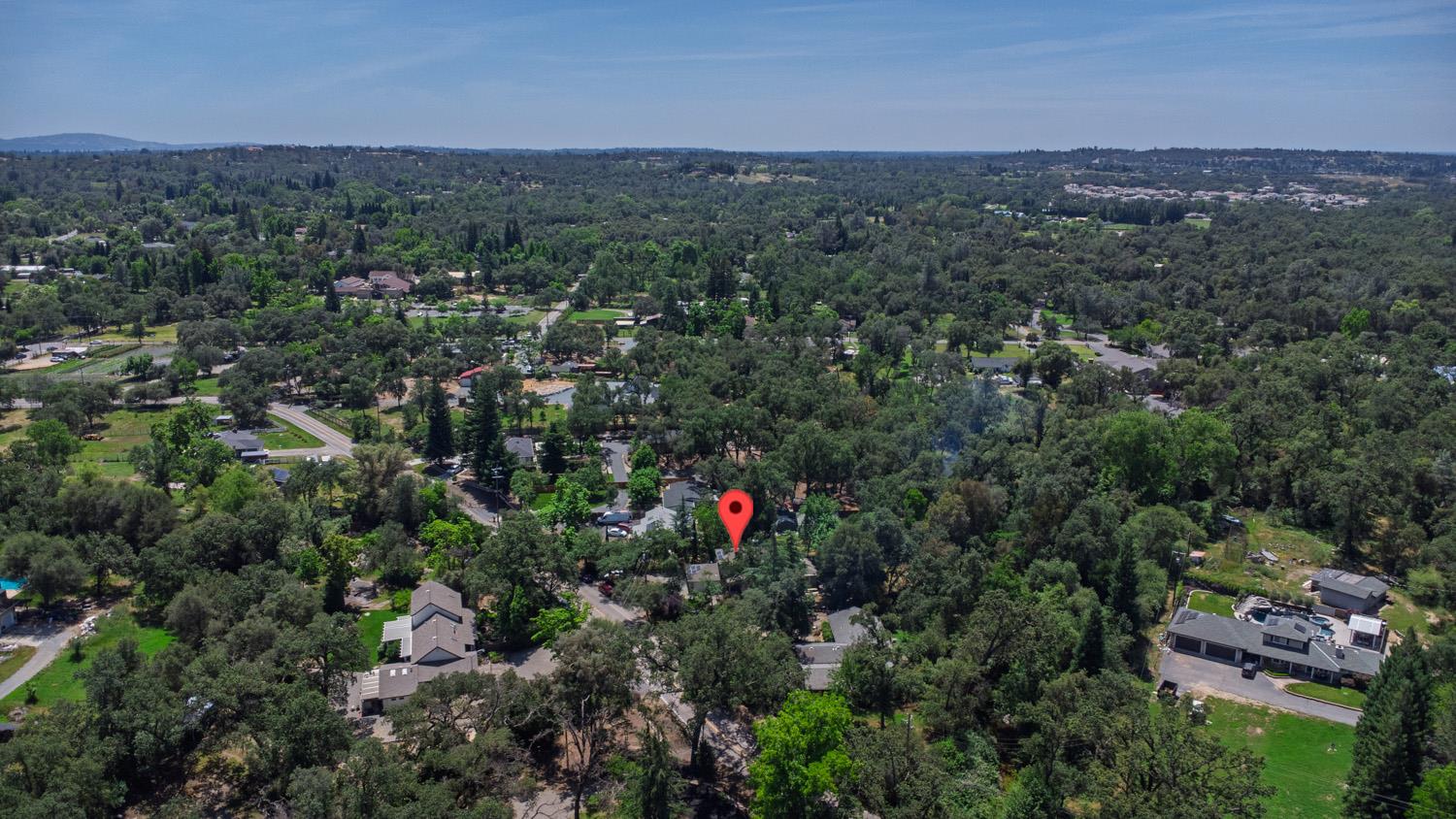 6332 Horseshoe Bar Road Loomis, CA 95650 - Photo 74 of 85 Aerial perspective showcasing a residential property nestled within a densely treed, expansive landscape