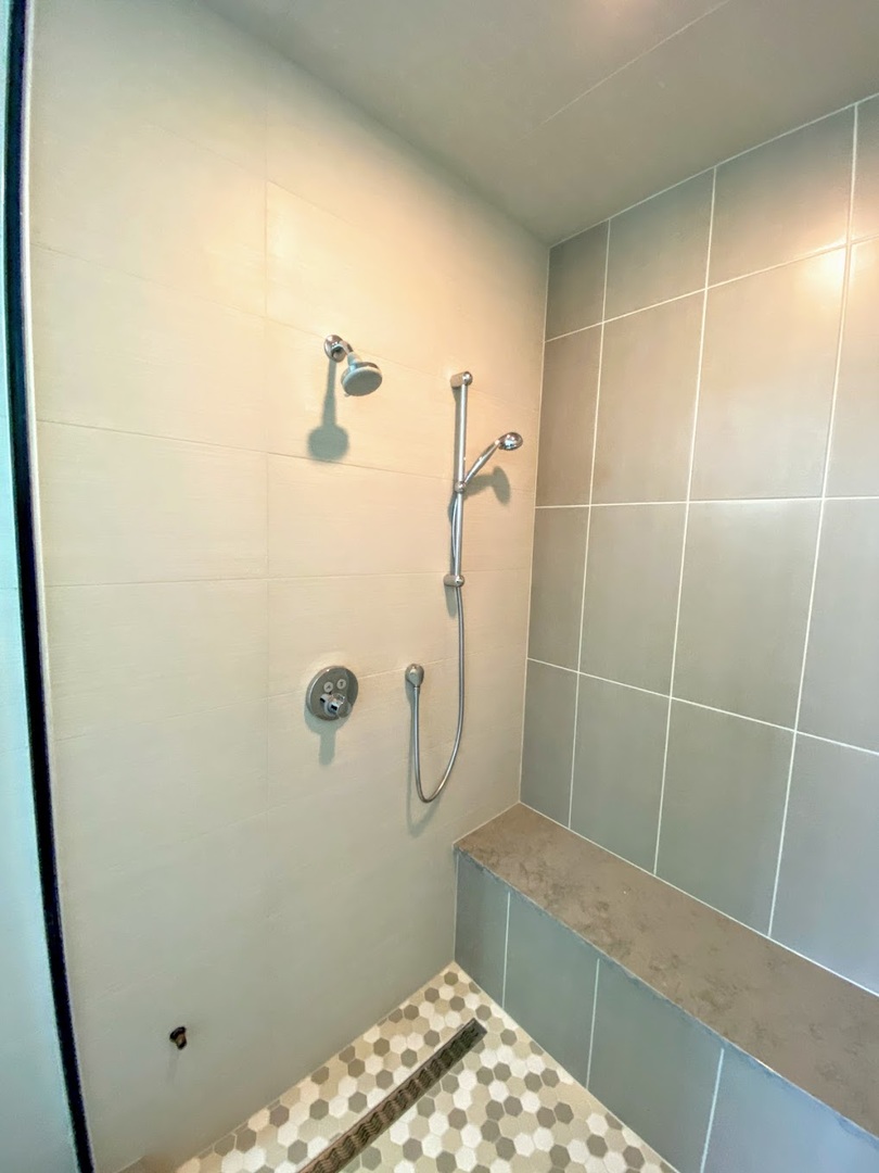 3203 North Ridgeway Avenue, Unit 2B Chicago, IL 60618 - Photo 9 of 15 a bathroom with a glass shower door