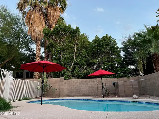 a view of a patio with a table and chairs