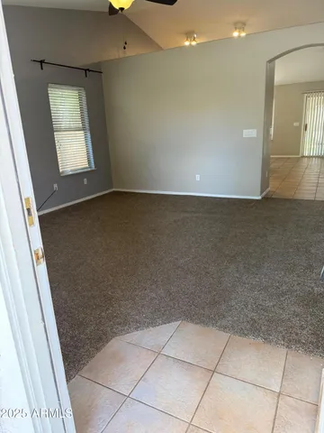 a view of an empty room with windows