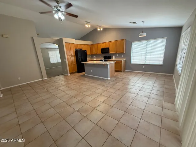 a kitchen with stainless steel appliances a refrigerator and microwave