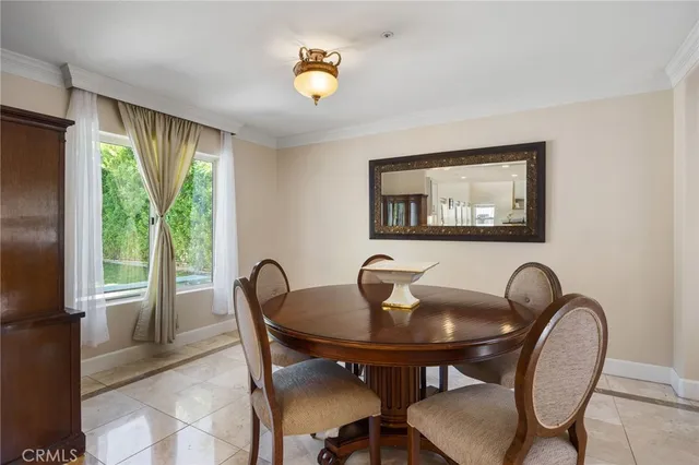 a view of a dining room with furniture and window