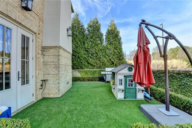 a living room with furniture fireplace and flat screen tv