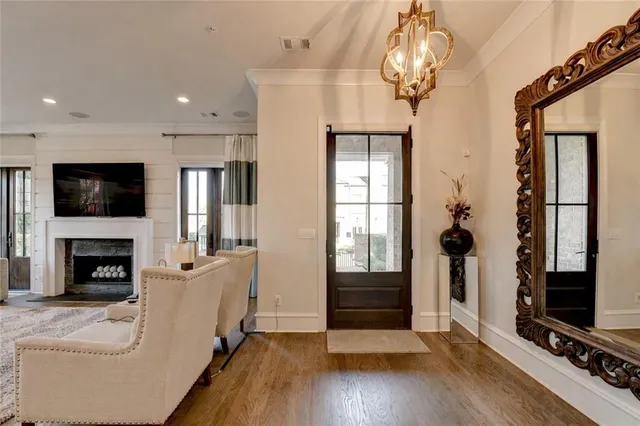 a living room with fireplace furniture and a flat screen tv