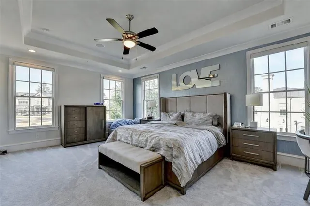 a view of a house with a yard and potted plants