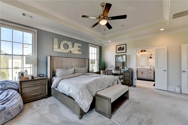 a backyard of a building with outdoor seating and a garden