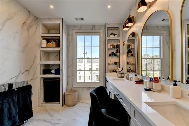 a view of a patio with couches and potted plants