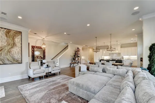 a living room with furniture flat screen tv and a fireplace