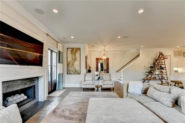 a view of a dining room with furniture wooden floor and a chandelier