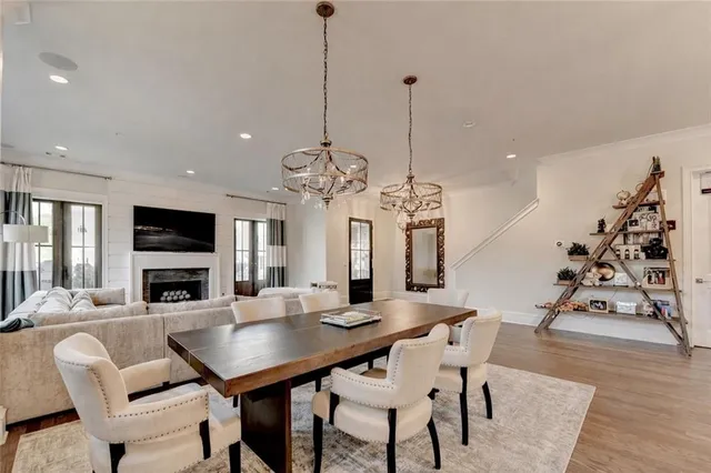 a kitchen with a sink a center island cabinets and a window