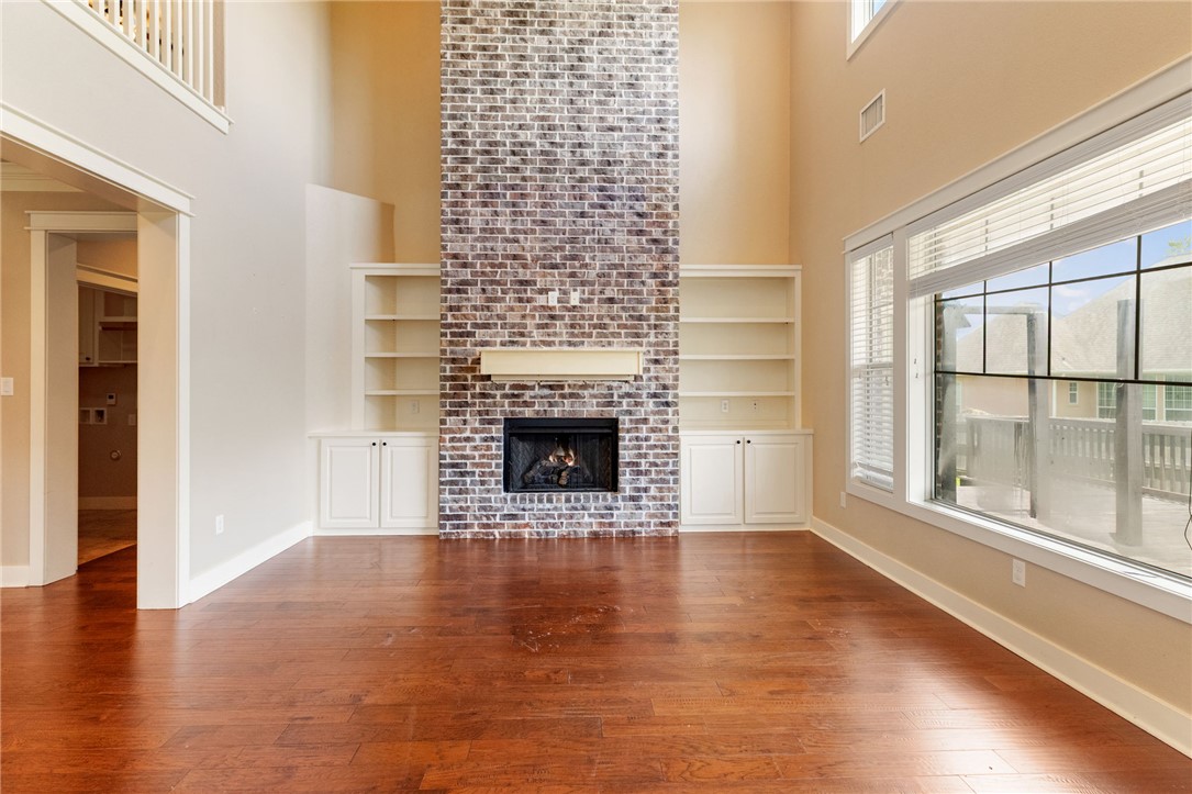 2136 Rockcliffe Loop College Station, TX 77845 - Photo 24 of 48 a view of a livingroom with wooden floor and a fireplace