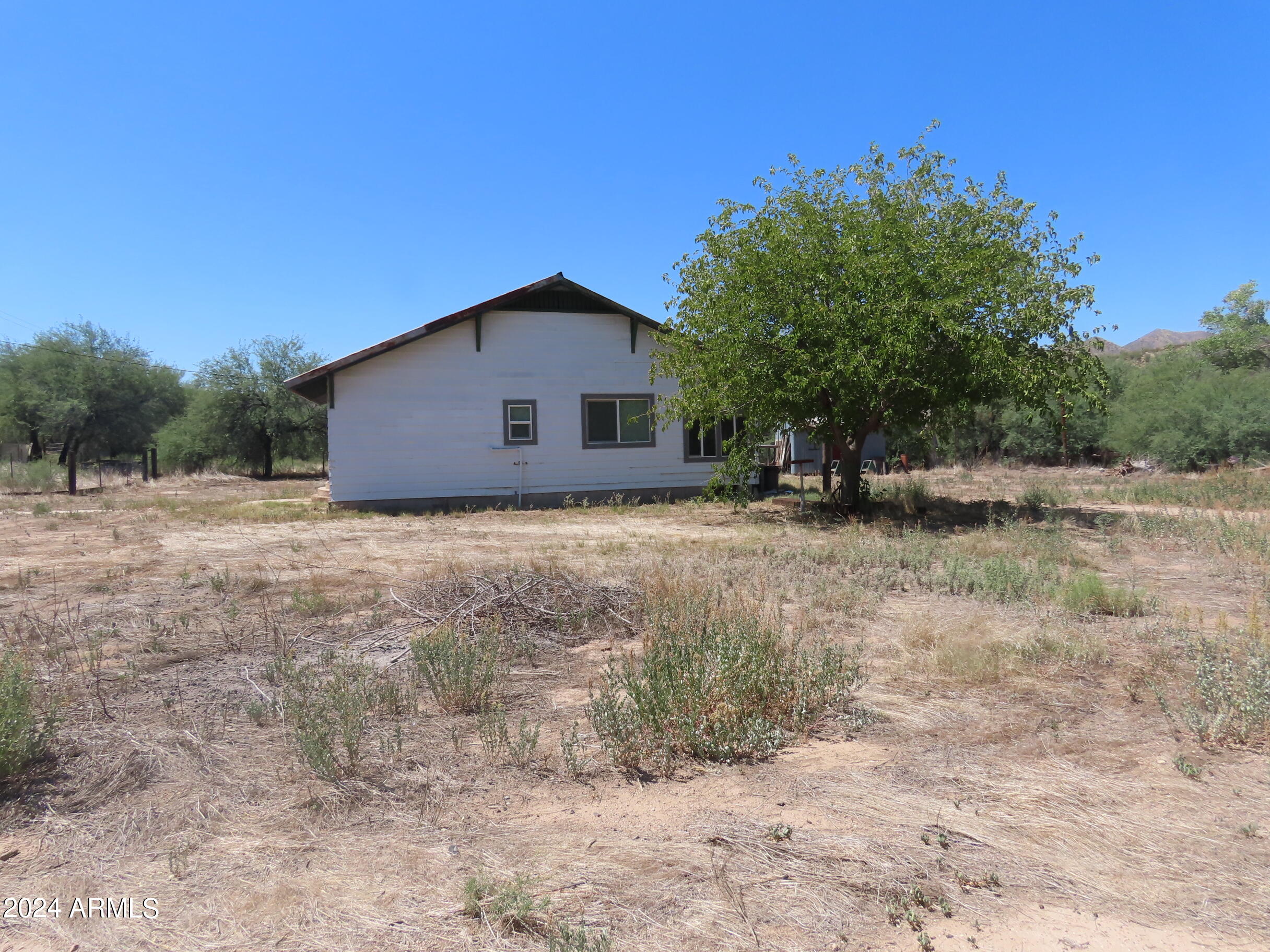 56120 East Riverside Road Kearny, AZ 85137 - Photo 20 of 28 a view of a house with a yard