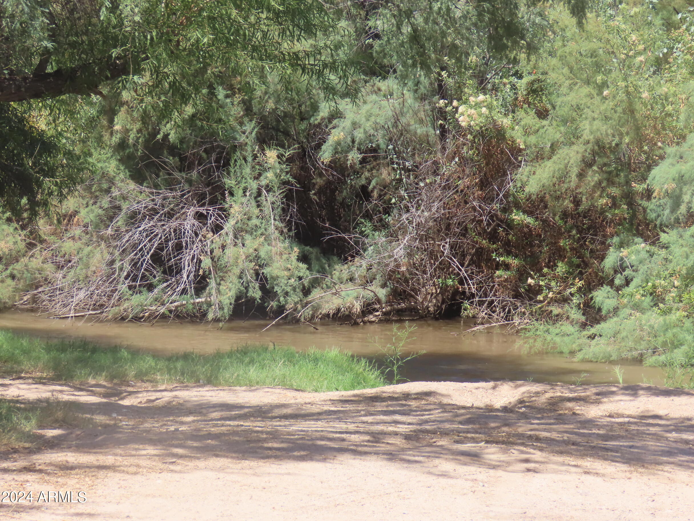 56120 East Riverside Road Kearny, AZ 85137 - Photo 21 of 28 a view of a lake with a mountain