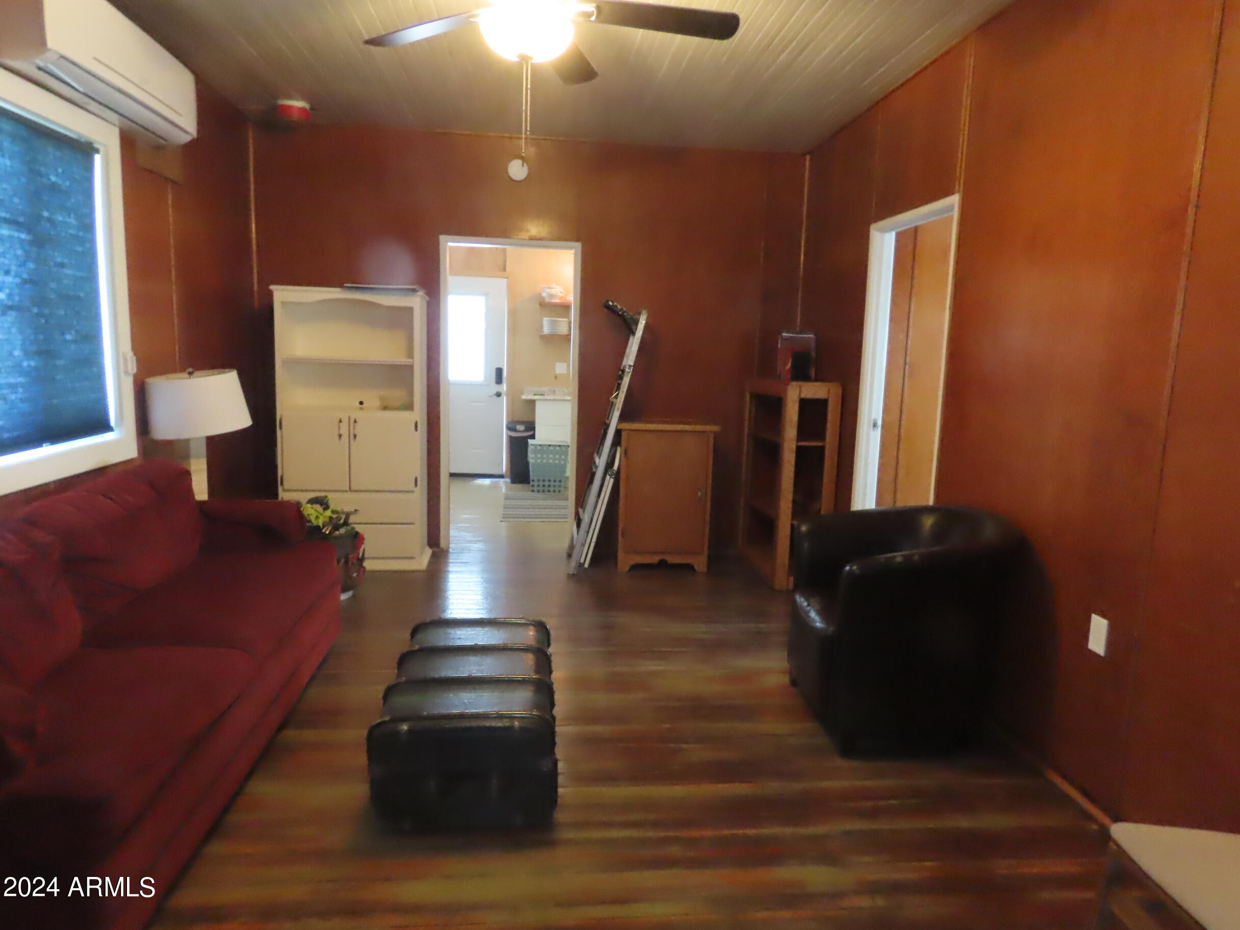 56120 East Riverside Road Kearny, AZ 85137 - Photo 6 of 28 a living room with furniture and a fireplace