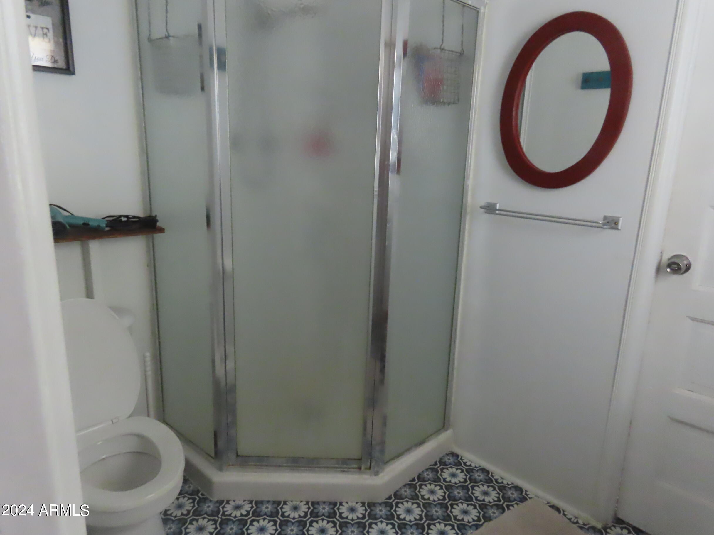 56120 East Riverside Road Kearny, AZ 85137 - Photo 9 of 28 a bathroom with a toilet and a shower