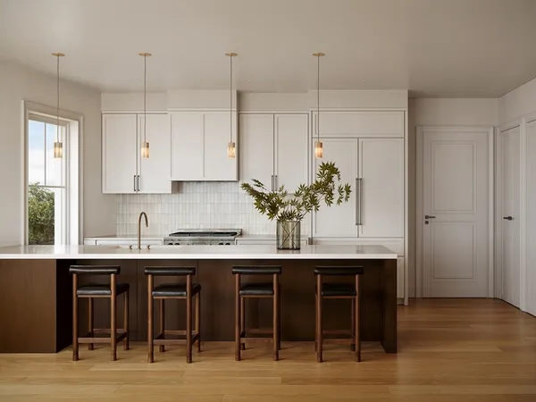 a kitchen with stainless steel appliances granite countertop a sink and cabinets
