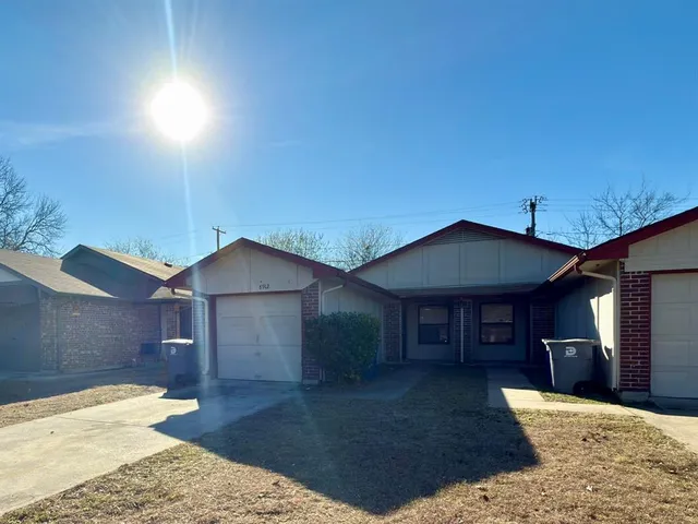 a front view of a house with yard