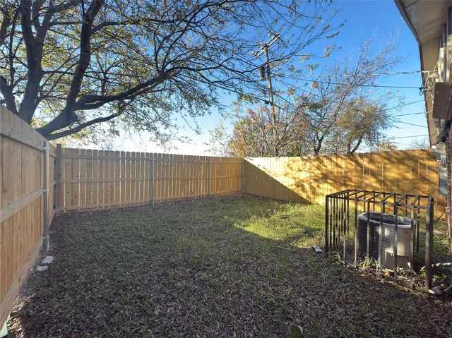 a view of backyard and tree
