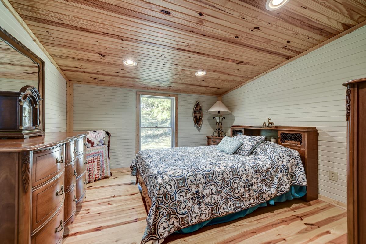 3838 W Road Springfield, TN 37172 - Photo 14 of 30 a bedroom with a large bed and a window