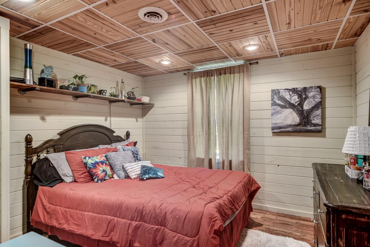 3838 W Road Springfield, TN 37172 - Photo 18 of 30 a bedroom with a bed and a flat screen tv