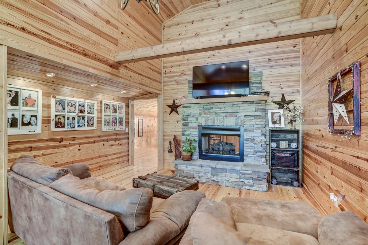 3838 W Road Springfield, TN 37172 - Photo 5 of 30 a living room with furniture and a fireplace