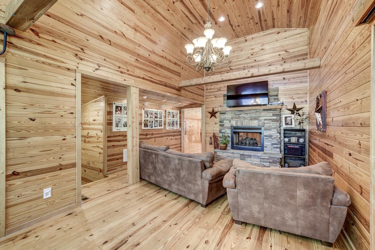 3838 W Road Springfield, TN 37172 - Photo 6 of 30 a living room with furniture wooden floor and a fireplace