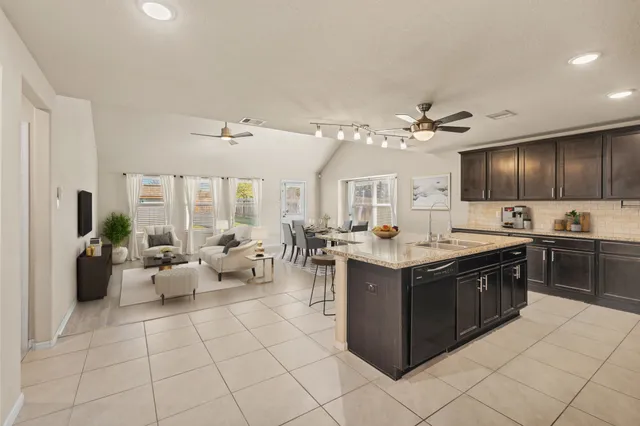 a view of a patio with a table and chairs