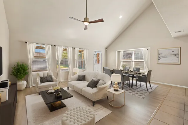 a view of a dining room with furniture and windows