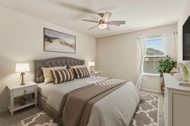 a bedroom with bed and a flat screen tv