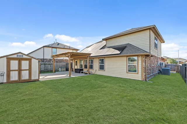 a house view with a play ground in front of it