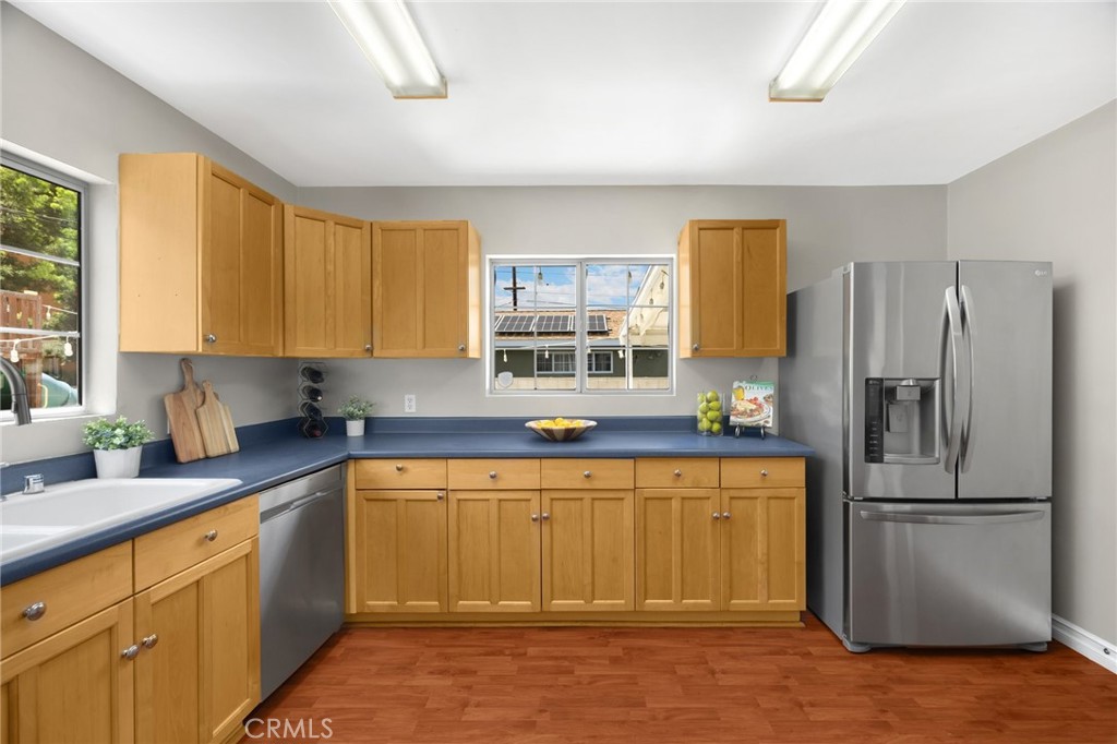 836 Willow Drive Brea, CA 92821 - Photo 11 of 35 a kitchen with a refrigerator sink and cabinets