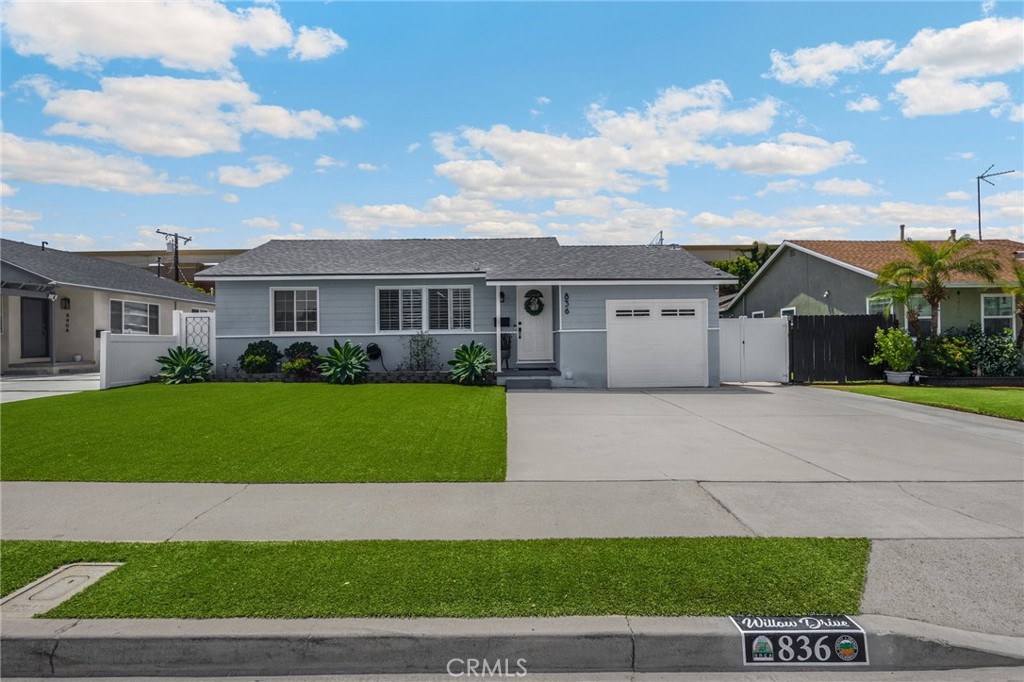 836 Willow Drive Brea, CA 92821 - Photo 2 of 35 a front view of a house with a garden and yard