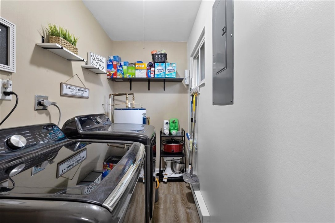 1482 Lee Road Troy, OH 45373 - Photo 22 of 30 This dedicated laundry space combines functionality with practical storage solutions.