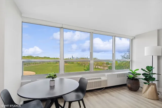 a view of a dining room with furniture window and outside view
