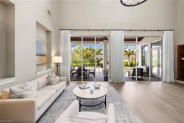 a kitchen with kitchen island a counter space a sink stainless steel appliances and cabinets