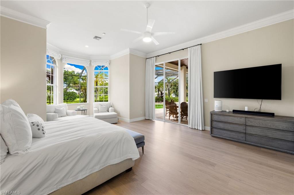 707 Hickory Road Naples, FL 34108 - Photo 17 of 38 a bedroom with a flat screen television and a bed