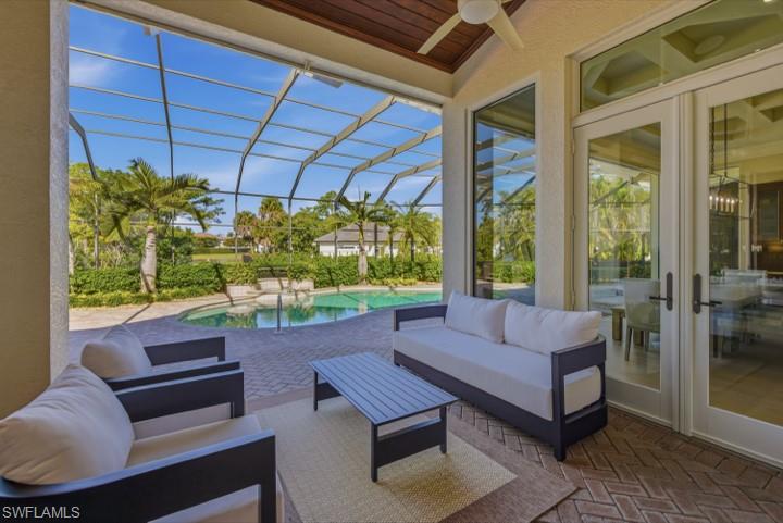 707 Hickory Road Naples, FL 34108 - Photo 25 of 39 a outdoor living space with furniture and a garden
