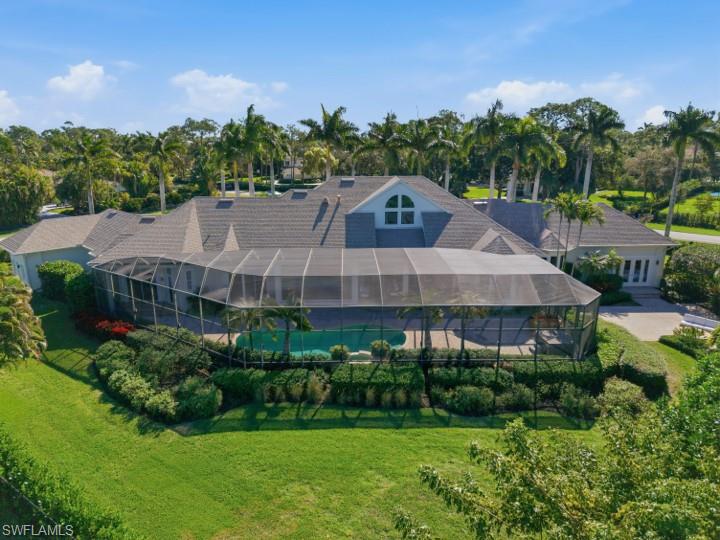 707 Hickory Road Naples, FL 34108 - Photo 6 of 39 a aerial view of a house with a yard and large trees