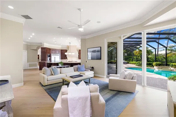a living room with furniture a fireplace and a table