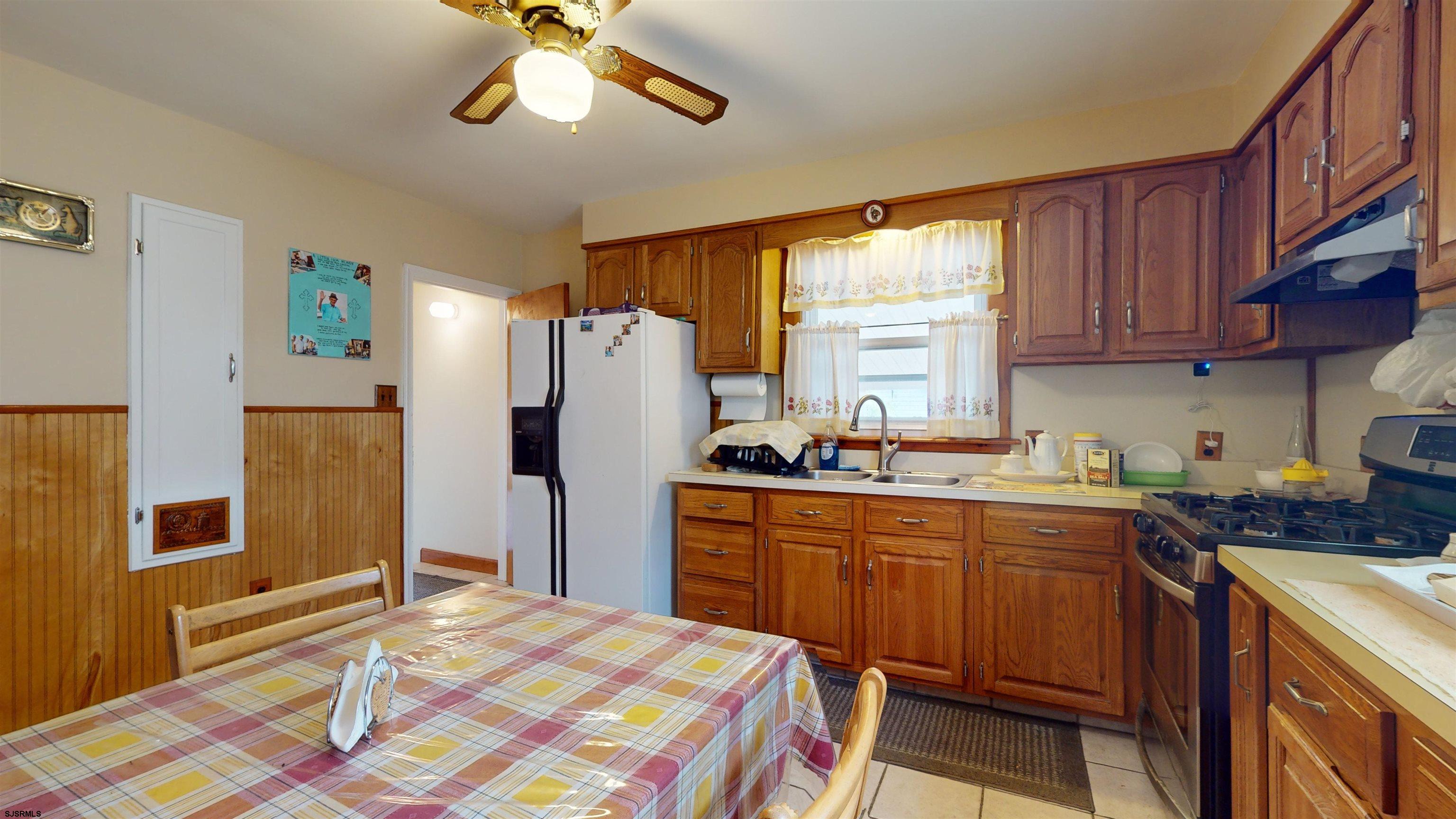 424 Pratt Street Hammonton, NJ 08037 - Photo 12 of 41 a kitchen with stainless steel appliances granite countertop a refrigerator and a stove top oven