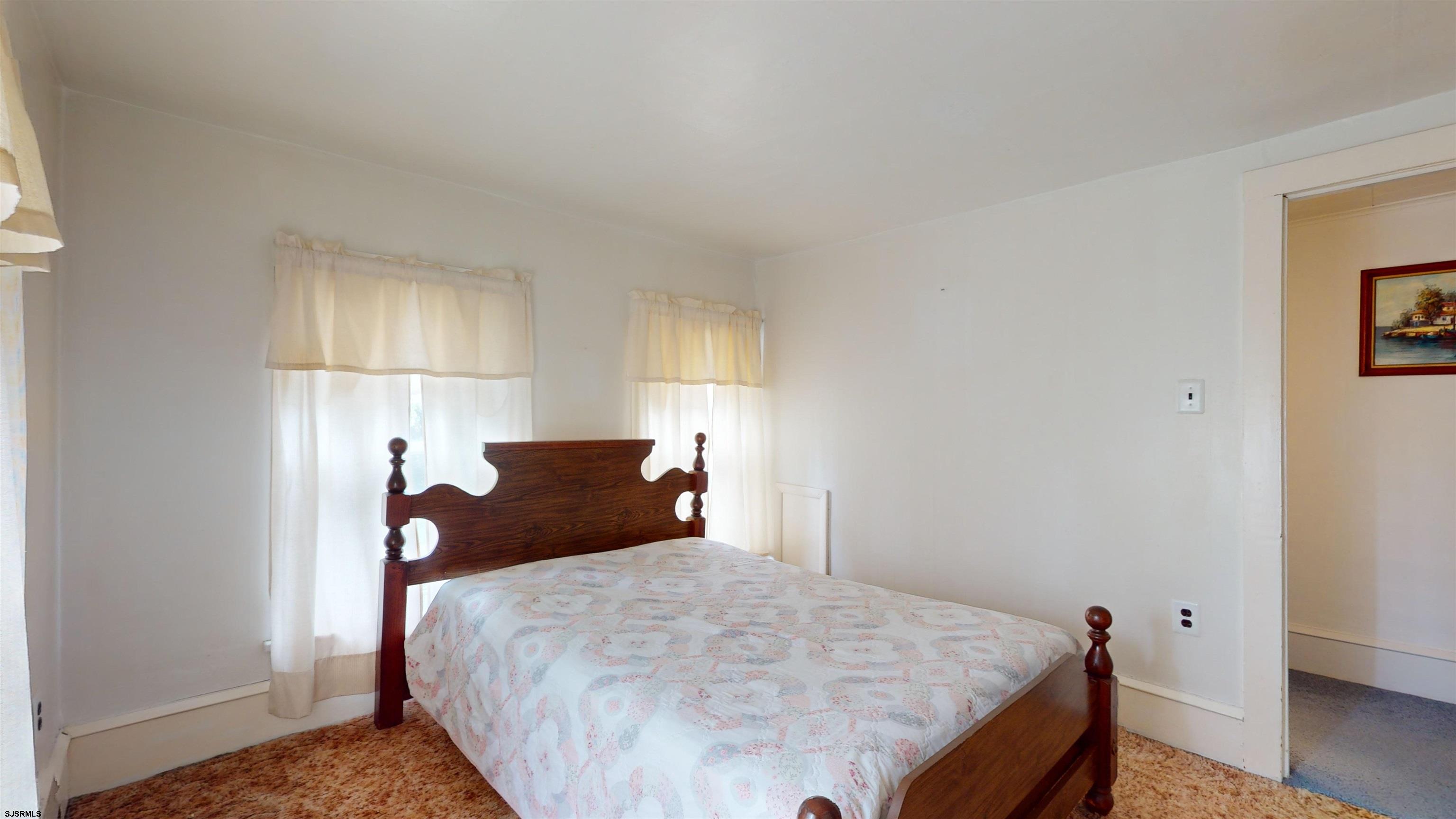 424 Pratt Street Hammonton, NJ 08037 - Photo 29 of 41 a bedroom with a bed and wooden floor