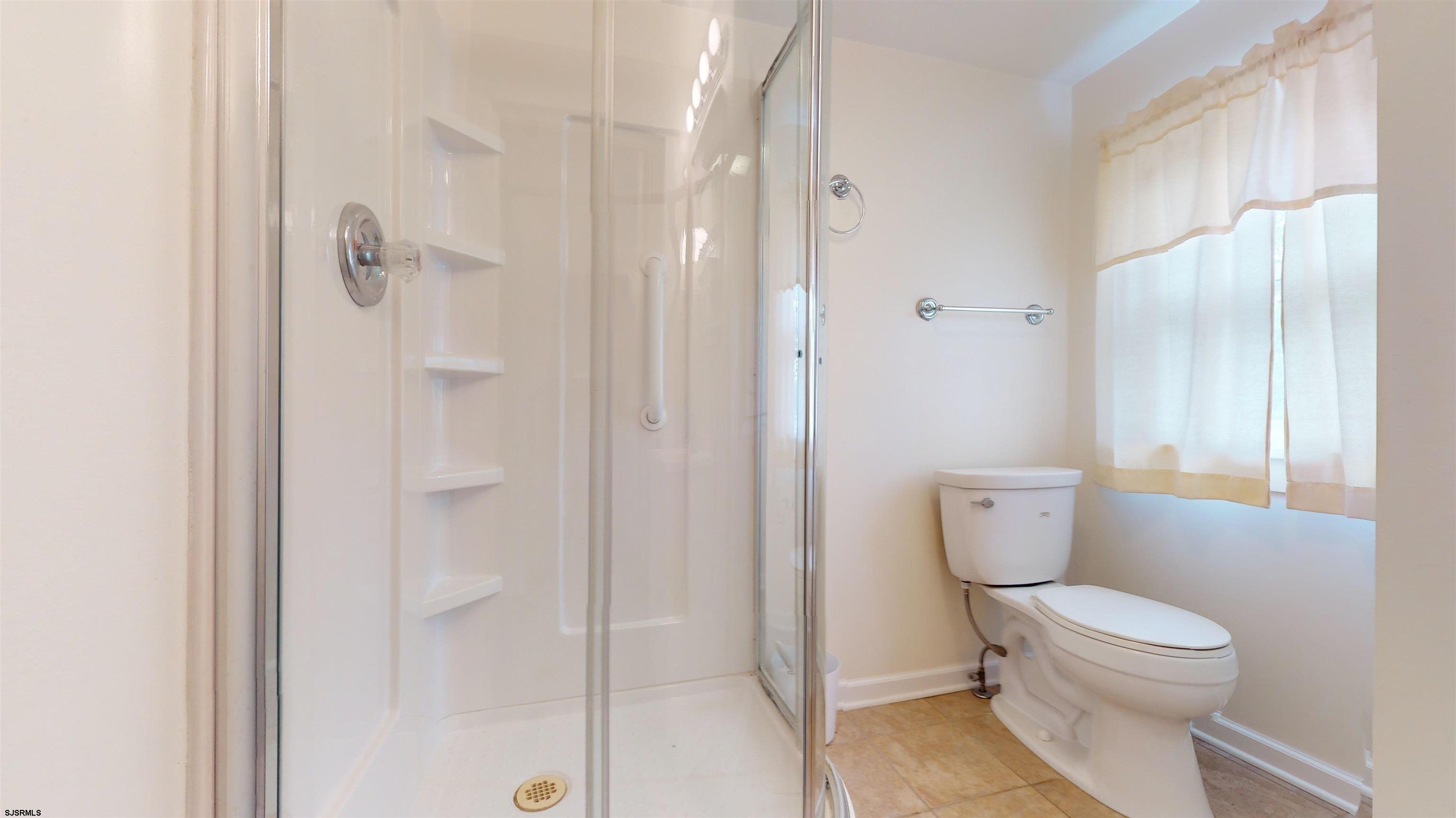 424 Pratt Street Hammonton, NJ 08037 - Photo 33 of 41 a bathroom with a toilet and a shower